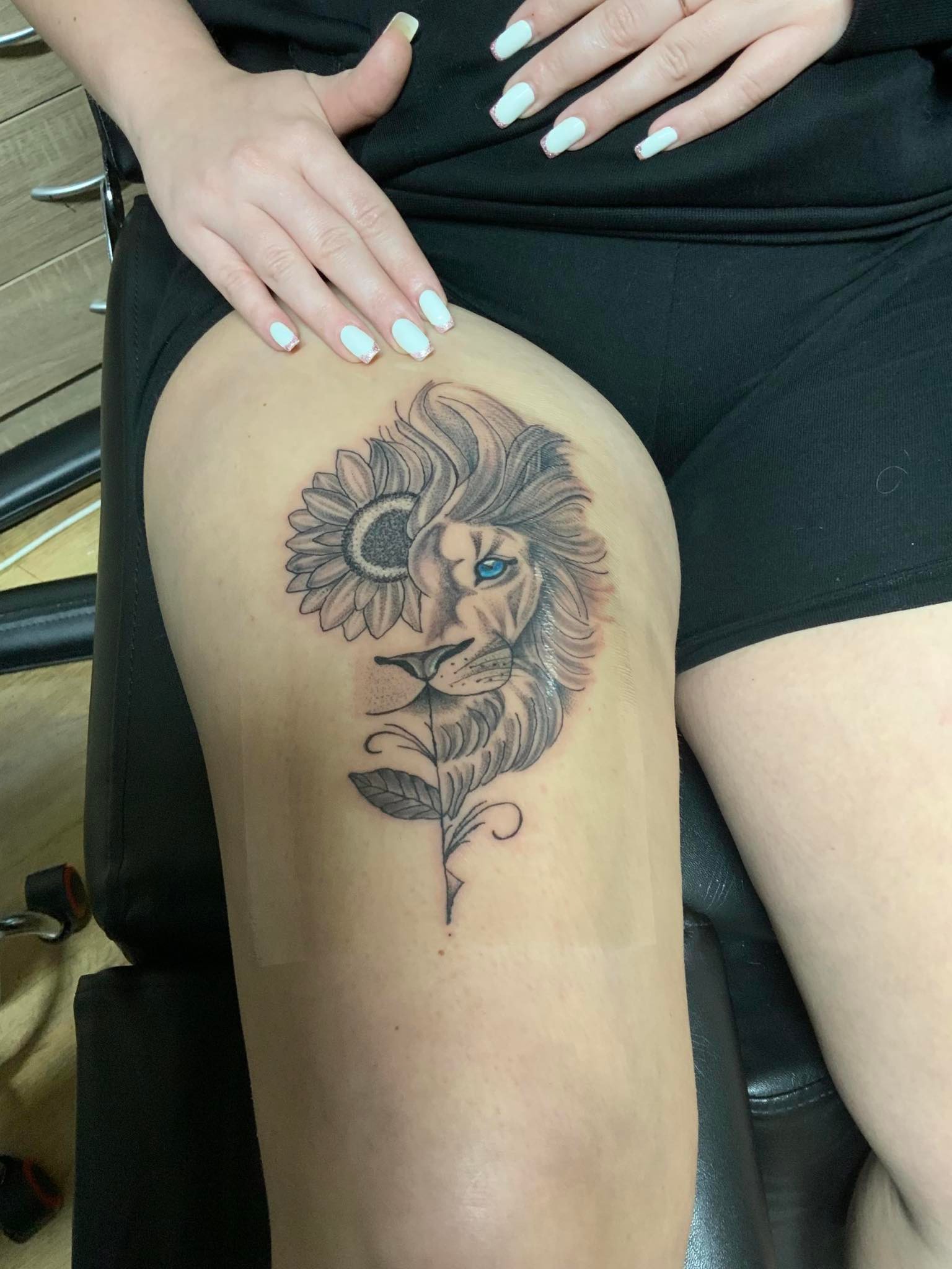 The tattoo of a half-lion, half-flower art piece